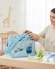 Stork And Baby blue nappy bag with 'I Love Shower' elephant graphic. Multiple compartments, spacious design.