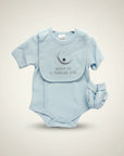 Stork And Baby light blue polka dot baby boy romper with moon and star embroidery and matching bib.