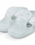 Stork And Baby white satin christening booties for boys featuring a delicate embroidered car design and velcro strap.