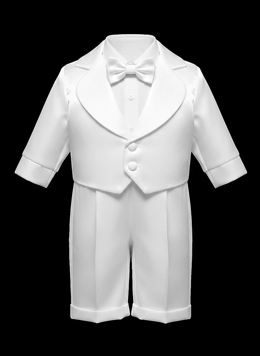 Stork And Baby white christening suit for boys featuring a long-sleeve jacket with tailpiece, bow tie, and shorts.