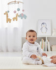 Stork And Baby white 100% cotton long sleeve baby set with a patterned collar and cuffs.