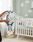 Stork And Baby Emerald Surfer baby boy starter pack, white cotton with green trim and vehicle print, includes onesie, hat, mittens, booties.