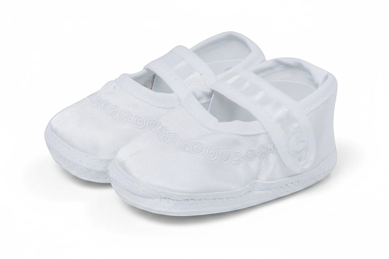 Stork And Baby white satin christening booties for girls featuring delicate embroidery and a secure velcro strap.