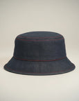 Stork And Baby dark blue denim bucket hat with red stitching detail for girls.