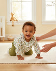 Stork And Baby girls set with white long-sleeve top featuring koala and leaf print and green pants.