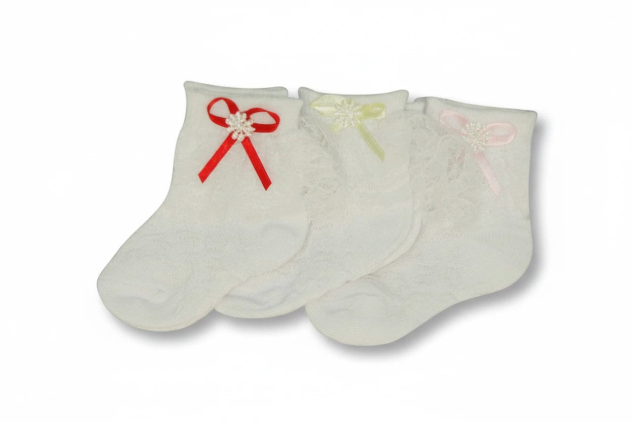 Stork And Baby white lace socks for girls with decorative red, yellow, and pink bows for christenings.