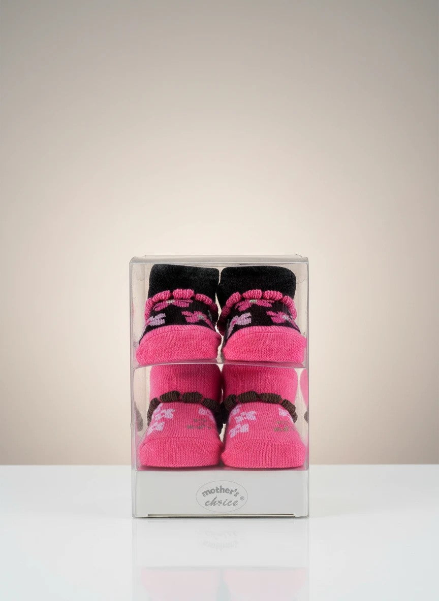 Stork And Baby girls 2-pack pink socks with floral pattern and ruffled trim, gift boxed.