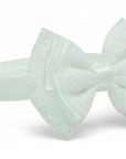 Stork And Baby Mothers Choice girls white satin alice band featuring a delicate lace bow detail.