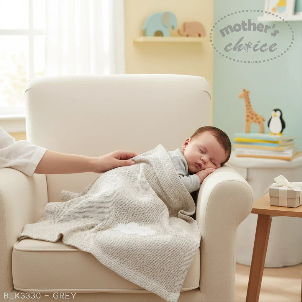 Stork And Baby grey cotton waffle blanket with cloud embroidery, perfect for newborns.