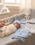 Stork And Baby infant boys 3-piece 100% cotton set with blue hat, bib, and booties featuring a red truck applique. Includes striped and car-print items.