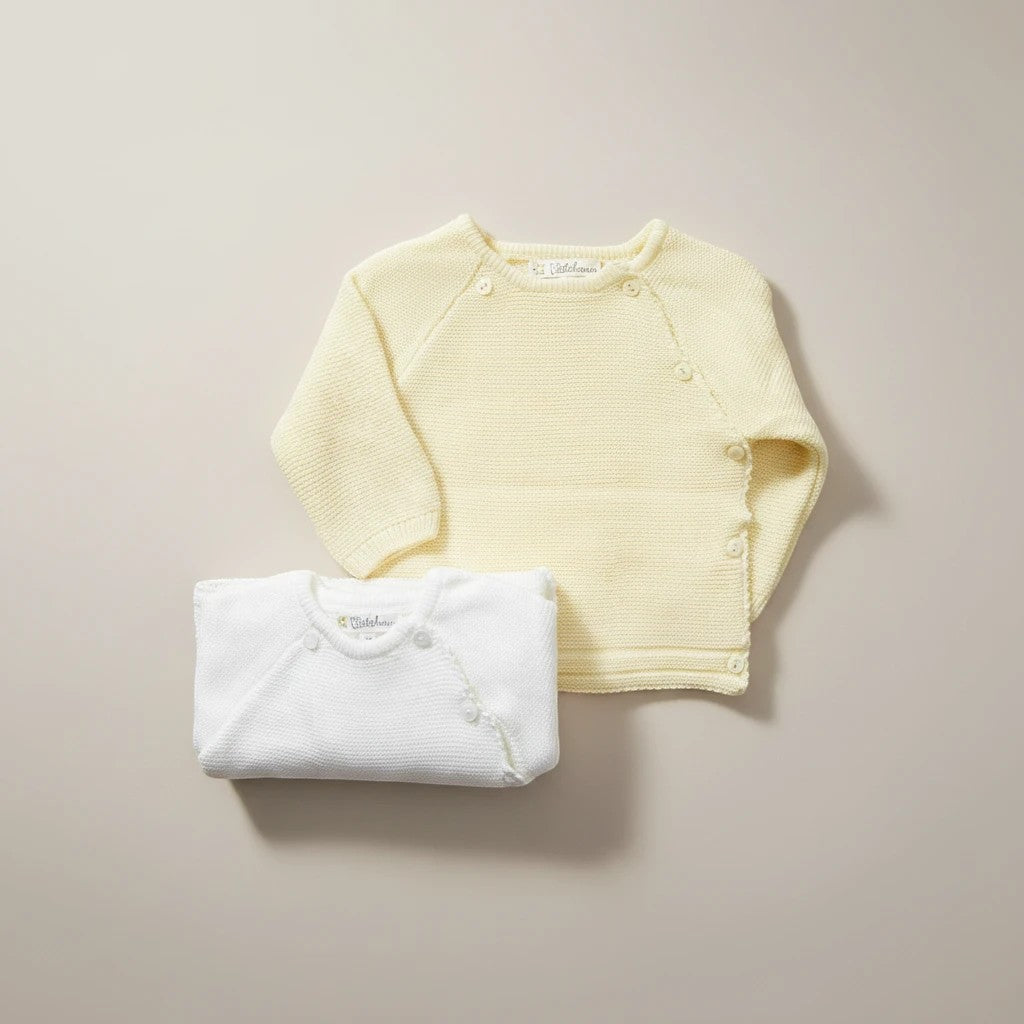 Stork And Baby yellow and white knit cardigans for infants. Soft, comfortable, and perfect for layering.