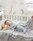 Stork and Baby grey and white polyester mink infant cutwork blanket with a cute animal pattern.