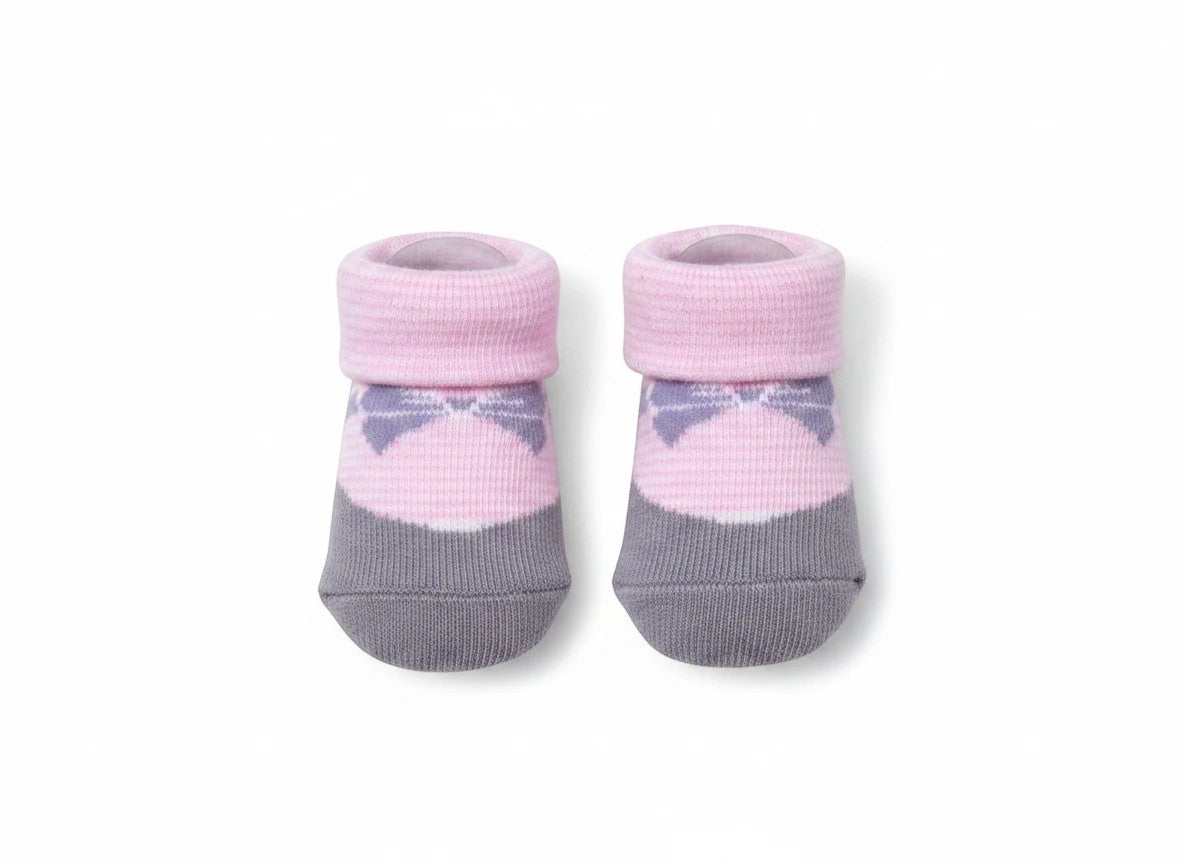 Stork And Baby infant girls socks in grey and pink with a bow design. Soft cotton blend, stretch fit.