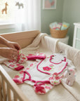 Stork And Baby white 5-piece infant grower set with pink floral print and embroidered tulips on bib.