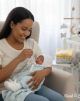 Stork and Baby white knitted bonnet and booties set for infants, soft and cozy for newborns.