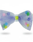 Stork And Baby Mother's Choice infant headband with a purple tulle bow featuring colorful pom-poms on a white lace band