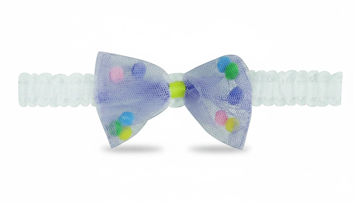 Stork And Baby infant headband featuring a purple tulle bow with colorful pom-poms on a soft white elastic band.