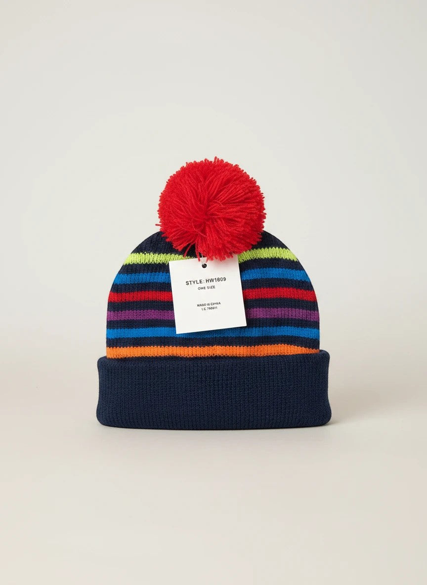 Stork And Baby navy knit infants winter hat with multi-colored stripes and red pom-pom.