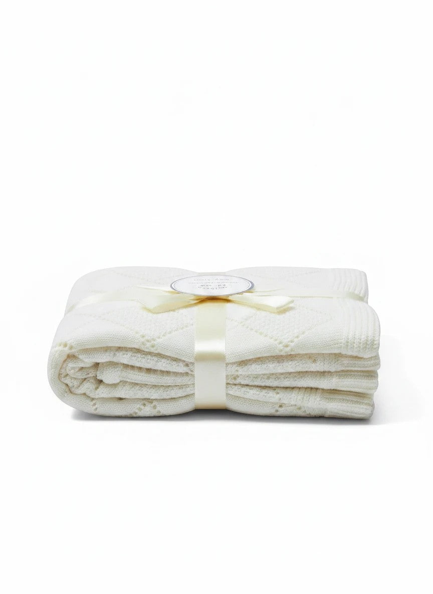 Stork And Baby Mothers Choice beige 100% cotton baby shawl with a soft diamond knit pattern and ribbon tie.