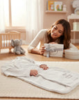 Stork And Baby Mothers Choice cotton baby sleeping bag with playful text in a cozy nursery setting with a smiling mother