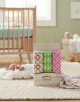 Stork And Baby Mothers Choice 3-pack floral cotton receiving blankets in a nursery with a sleeping baby.