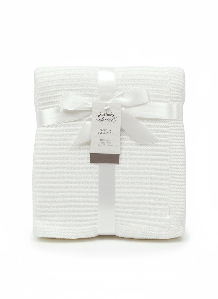 Stork And Baby Mothers Choice white 100% acrylic knit baby shawl, folded with a satin ribbon and product tag.