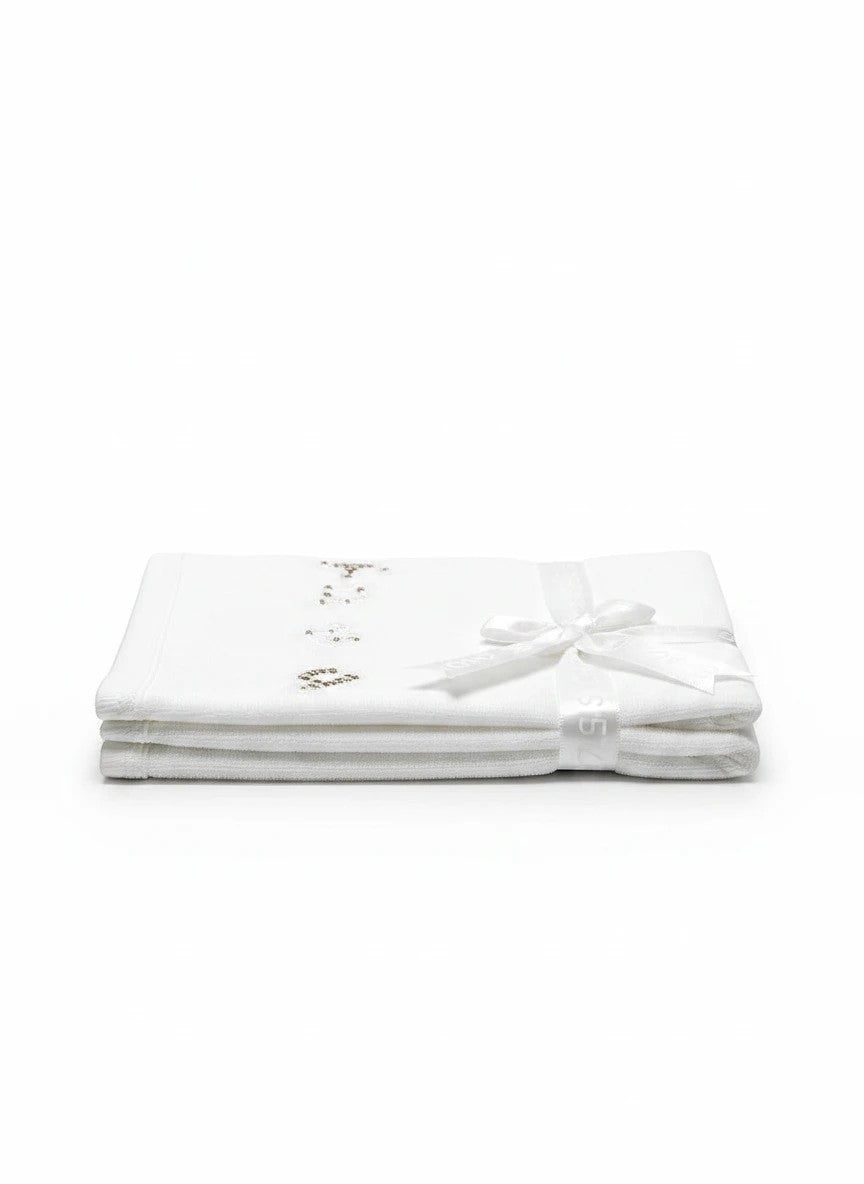 Stork And Baby Mothers Choice white 100% cotton jersey baby wrap, folded and tied with a ribbon for a gift.