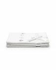 Stork And Baby Mothers Choice white 100% cotton jersey baby wrap, folded and tied with a ribbon for a gift.