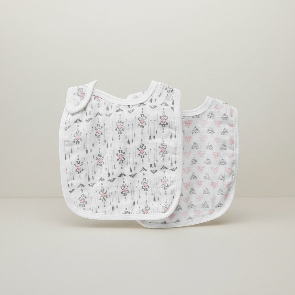 Stork And Baby 2 pack white muslin bibs with grey and pink arrows and hearts pattern. Lightweight and breathable.