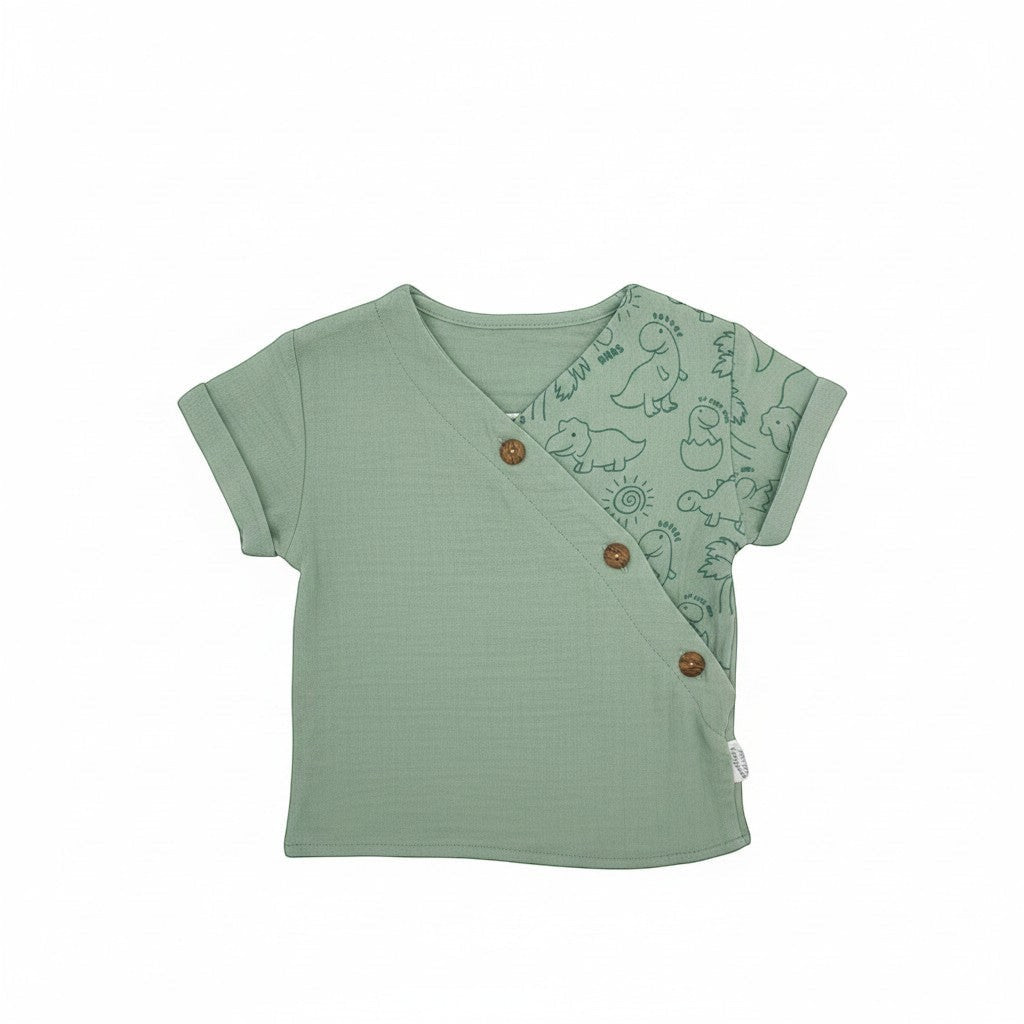 Stork And Baby 2 piece muslin set in sage green with a dinosaur print on the sleeve and wooden buttons.