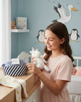 Stork And Baby navy and white striped dough boy hat for infants, soft and comfortable for everyday wear.