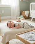 Stork And Baby 5 piece newborn gift set with grey elephant print bodysuit, pants, socks, bib and cap.