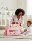 Stork And Baby Mothers Choice pink butterfly nappy bag with organized compartments and a bow.