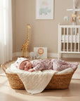 Stork And Baby pink creature print baby grower and hat set made of soft cotton, featuring a sleeping baby.
