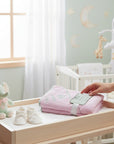 Stork And Baby pink 100% cotton hooded towel with 'I Melt Daddy's Heart' embroidery and grey trim.