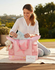 Stork And Baby pink nappy bag with a teddy bear and bottle holder, featuring a large star and 'No. 1' graphic.