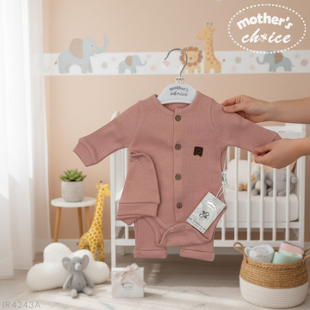 Stork And Baby pink ribbed 3-piece newborn set with bodysuit, hat, and pants. Features wooden buttons and a cute patch.