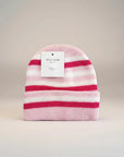 Stork And Baby pink and white striped knit infants winter hat with a folded brim.