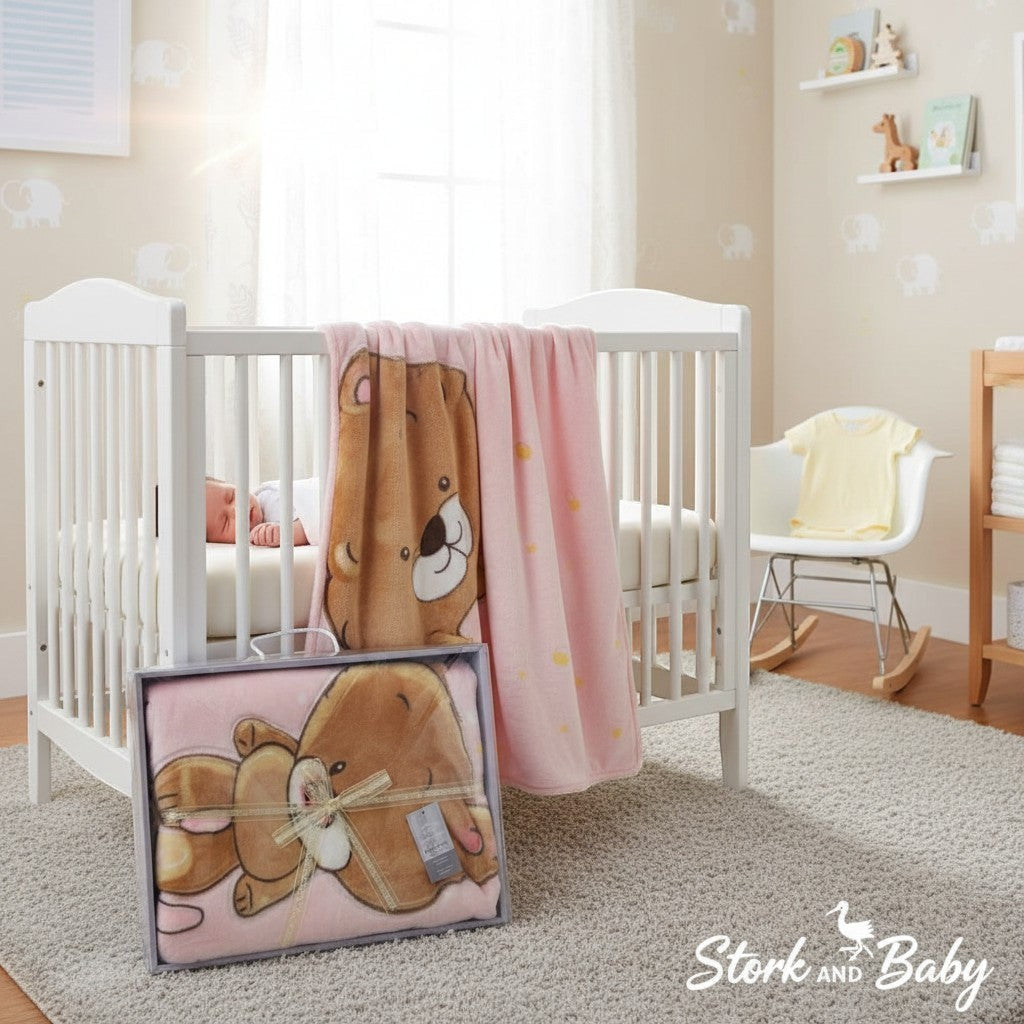 Stork And Baby pink cutwork baby blanket with teddy bear print, perfect for a girl.