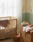 Stork And Baby pink and white striped knit cardigans for infants, soft and cozy for baby girls.
