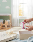 Stork And Baby white quilted cotton sleepsuit with pink trim and cat print, perfect for cozy naps.