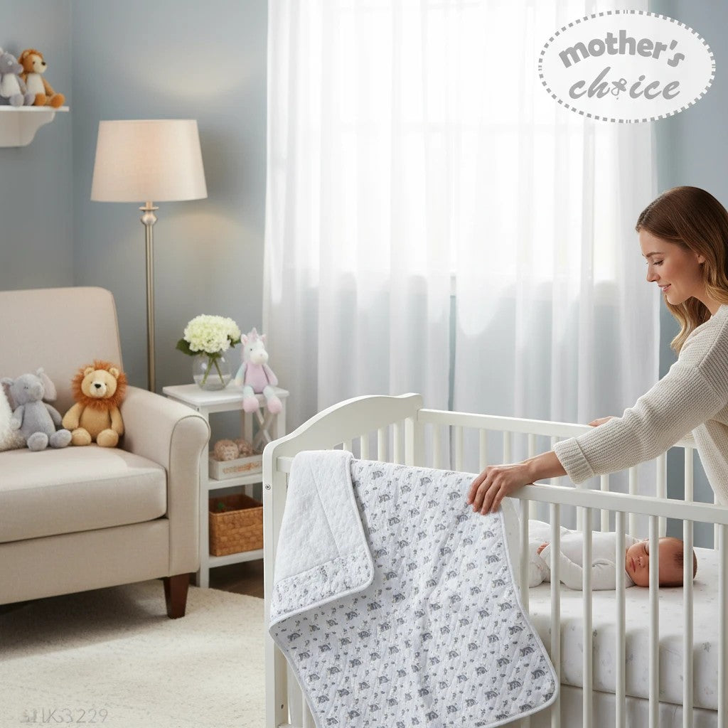 Stork And Baby grey and white quilted cotton baby blanket with rainbow and elephant print