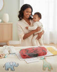 Stork And Baby red toddler walking harness, an essential for active babies exploring outdoors or in busy spaces.
