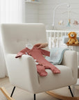 Stork And Baby rose pink 100% cotton ribbed baby romper with side buttons and tassel detail.