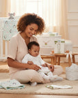 Stork And Baby Mother's Choice white tights with pink floral pattern for baby girls, soft stretchy fit.