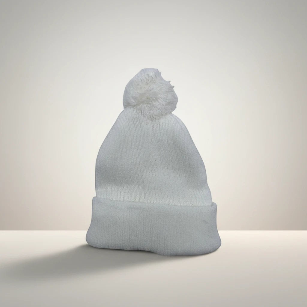 Stork And Baby white knit infant earflap hat with pom pom. Soft, cozy, and warm for winter.