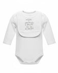 Stork And Baby white long sleeve bodysuit with attached bib that says "when I grow up, I want to be a baby"
