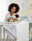 Stork and Baby white quilted cotton receiving blanket with "Dream Big Little One" embroidery and moon print.