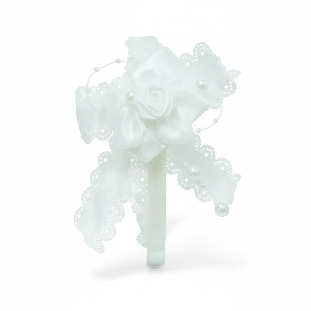 Stork And Baby white satin girls alice band featuring a decorative bow, fabric rose, lace trim, and pearl accents.